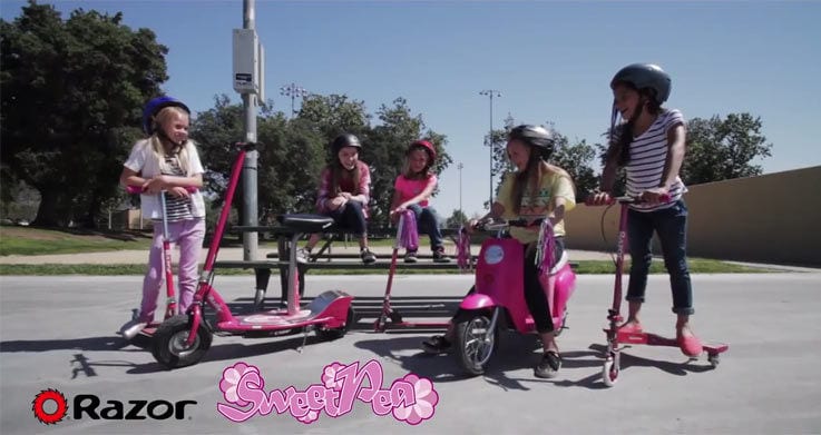 A group of girls riding Best electric scooter models for kids