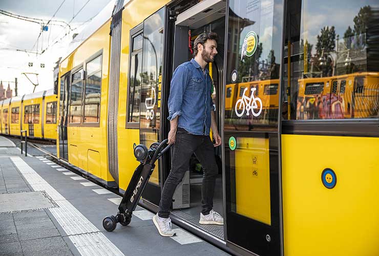folded scooter taken on a buss or train